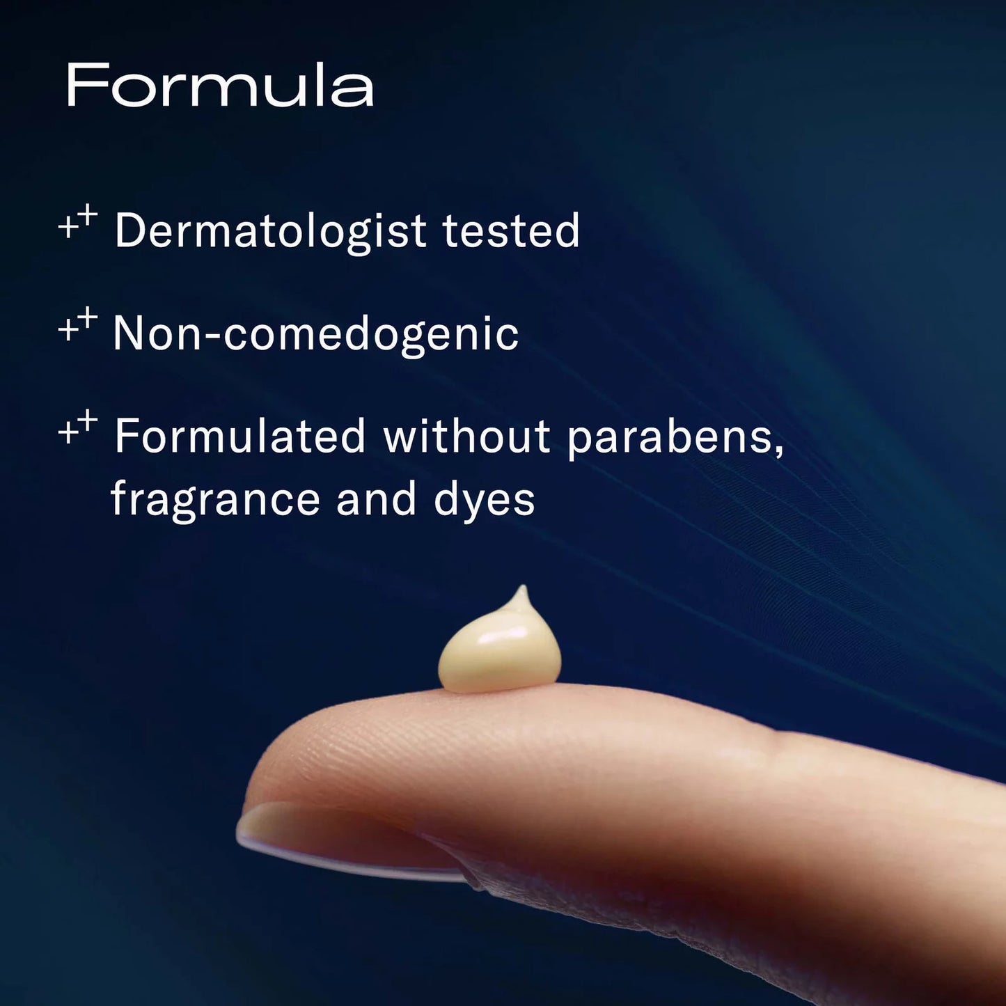 Droplet of cream on a finger with dermatologist-tested, non-comedogenic, paraben-free product description on a dark background.