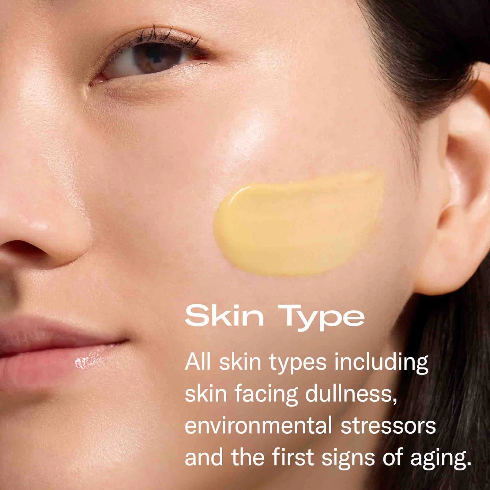 Close-up of a woman's face with a swatch of yellow foundation or cream product on her cheek and white text reading 'Skin Type' and a descriptive caption about skin types and aging.