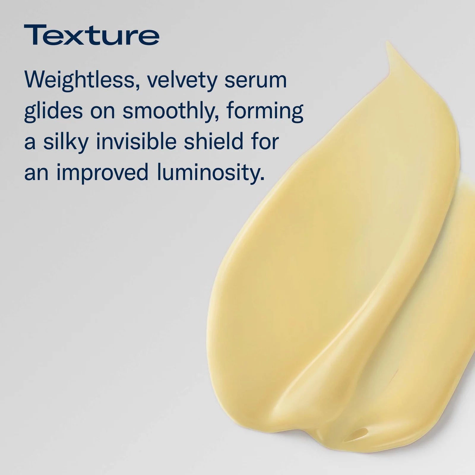 A pale yellow cream product smear on a light gray background with dark blue text describing a weightless, velvety texture and silky finish.